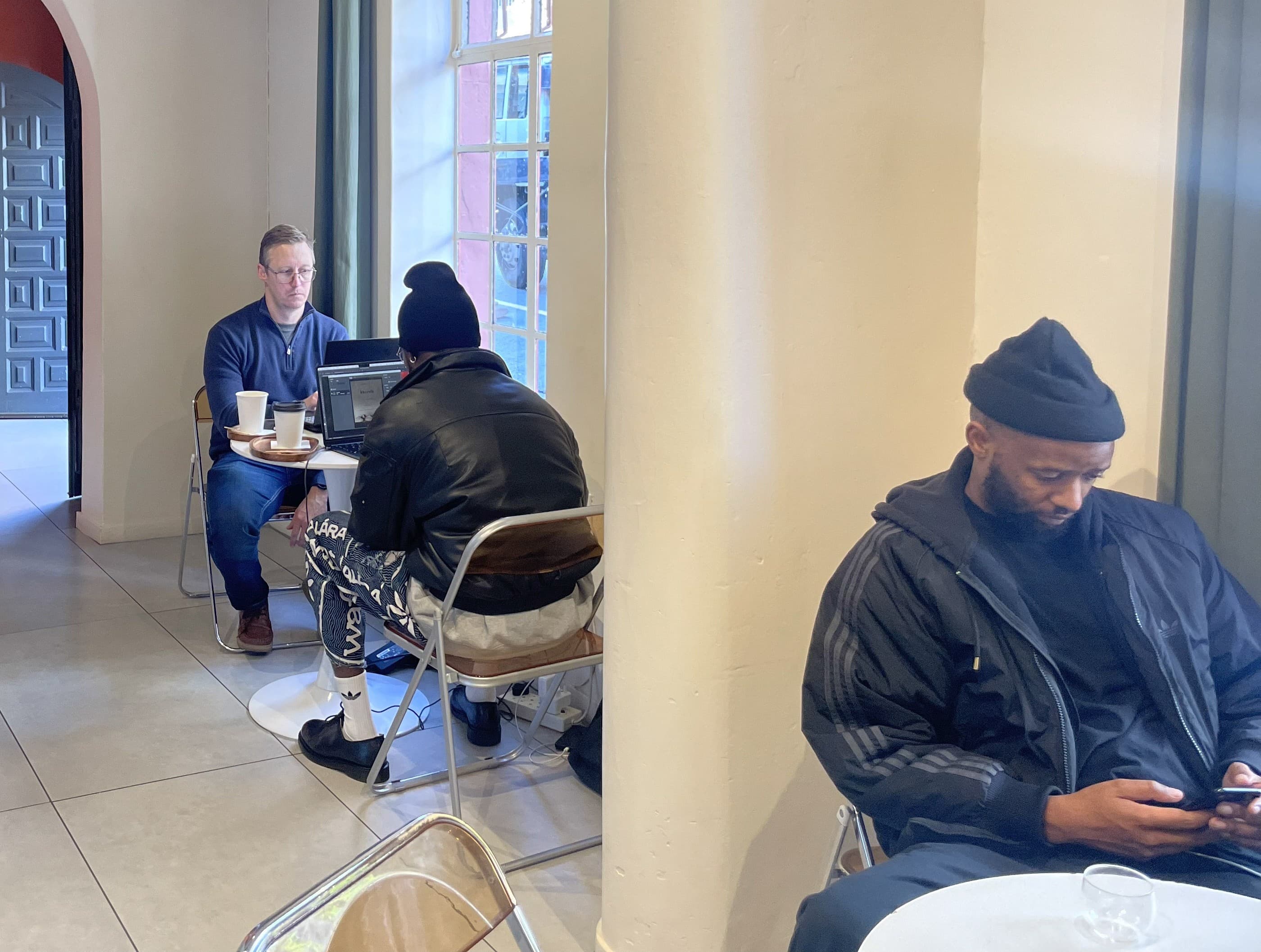 Builders collaborating over coffee at Mamakashaka & Friends during the meetup